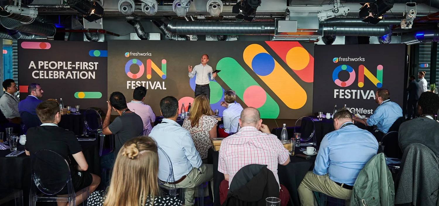 A speaker on stage at Freshworks ON Festival addressing the audience